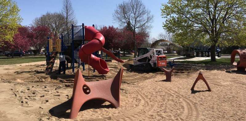 Sand placed into a playground to refresh the existing material by bedrock slingers