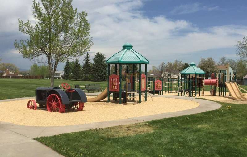 Slinger trucks replaced sand of a multi-level playground with EWF to create a safe, ADA accessible playground surface