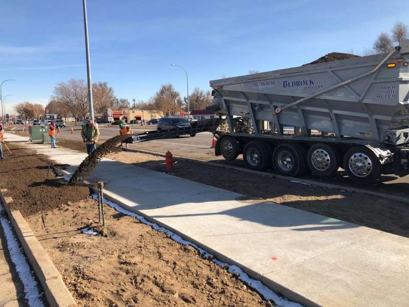 Bedrock’s Slinger placing screened topsoil with remote slinger truck in Colorado